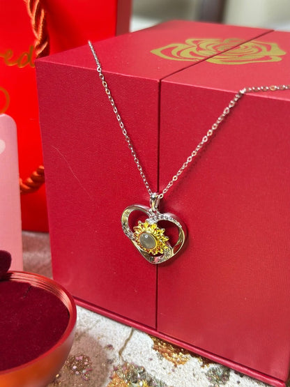 Girasol Megan - Collar te Amo en 100 idiomas en caja de rosa ascendente - Podios